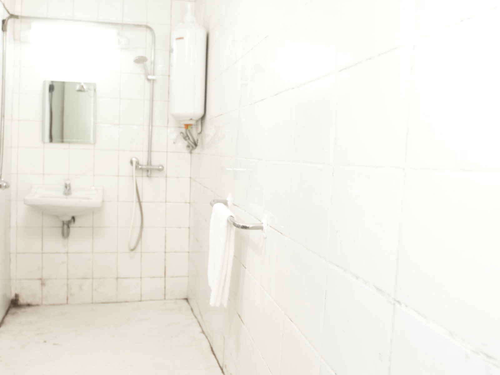 Private bathroom in a Deluxe Room at OPS Guest House, Dhulagori